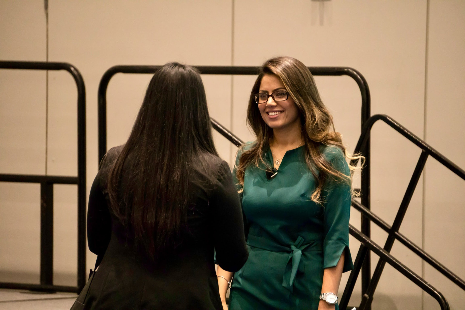 Sandeep Aujla connecting with an attendee between sessions